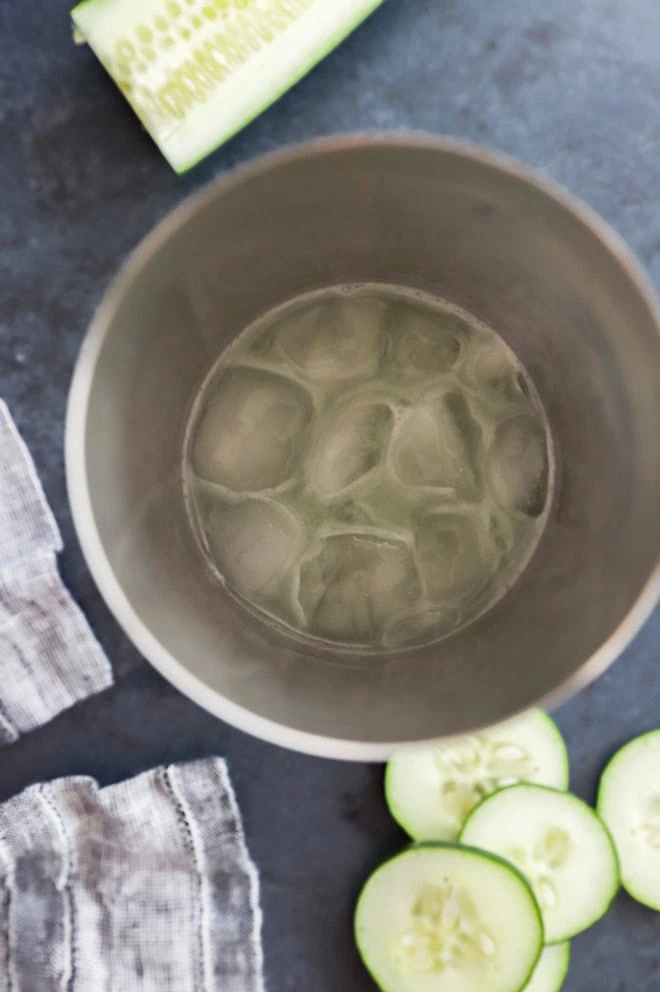 cucumber martini in a shaker filled with ice