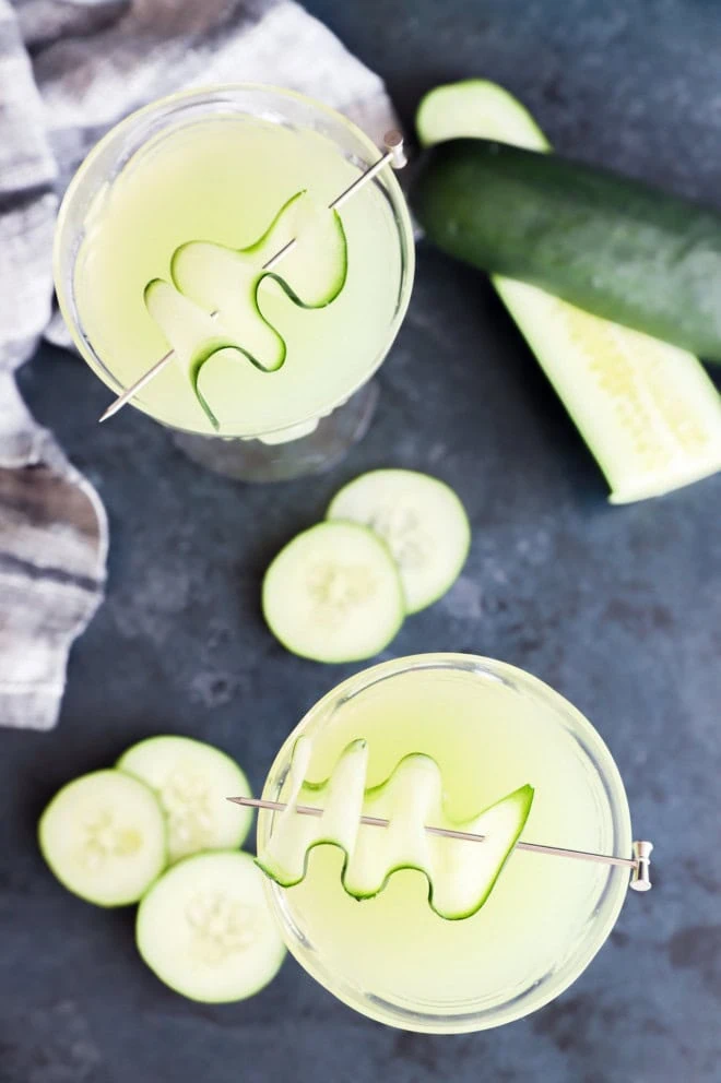 cucumber martinis in coupe glasses with cucumber garnish