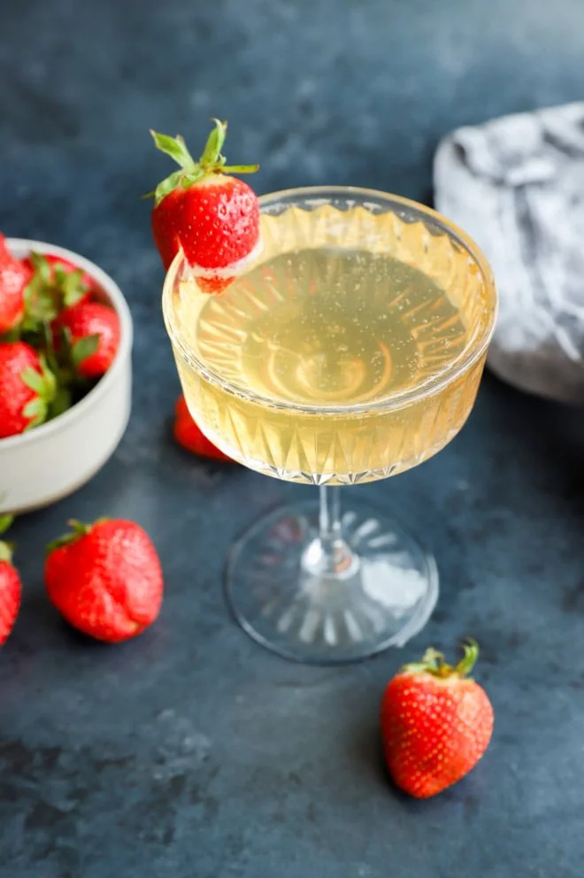 fresh fruit in a bowl with sparkling wine cocktail