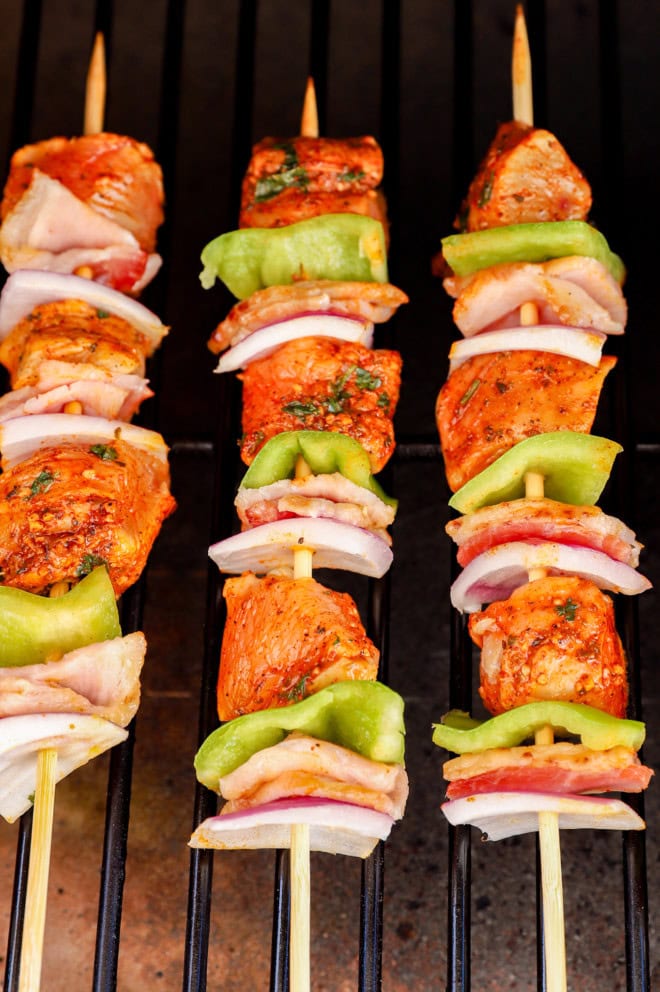 grilled bbq chicken skewers on the grill