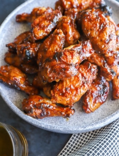 hot honey whiskey wings on a plate image