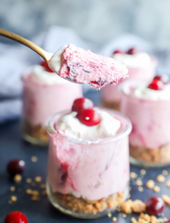 Spoonful of cranberry cheesecake mousse from jar