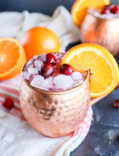 Copper mugs with cranberry moscow mule with orange