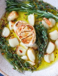 Overhead image of roasted garlic in a bowl