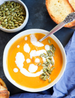 Picture of fall soup in bowl with bread and seeds