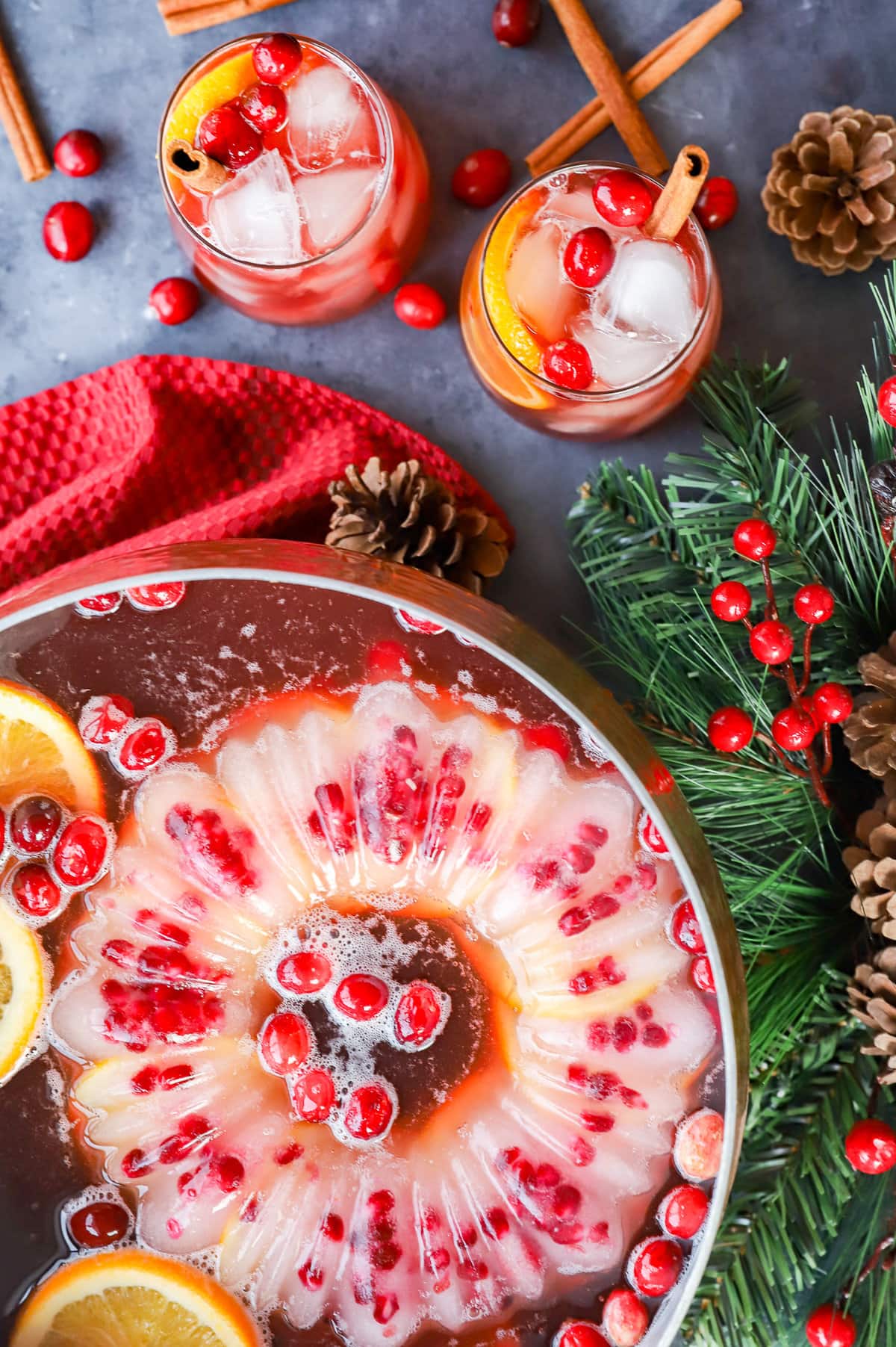 punch bowl with ice mold and cranberries and oranges