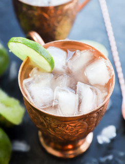 copper moscow mule mug with ginger beer and lime wheel