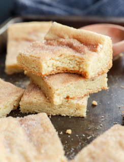 stack of cinnamon sugar cookies with bite taken out