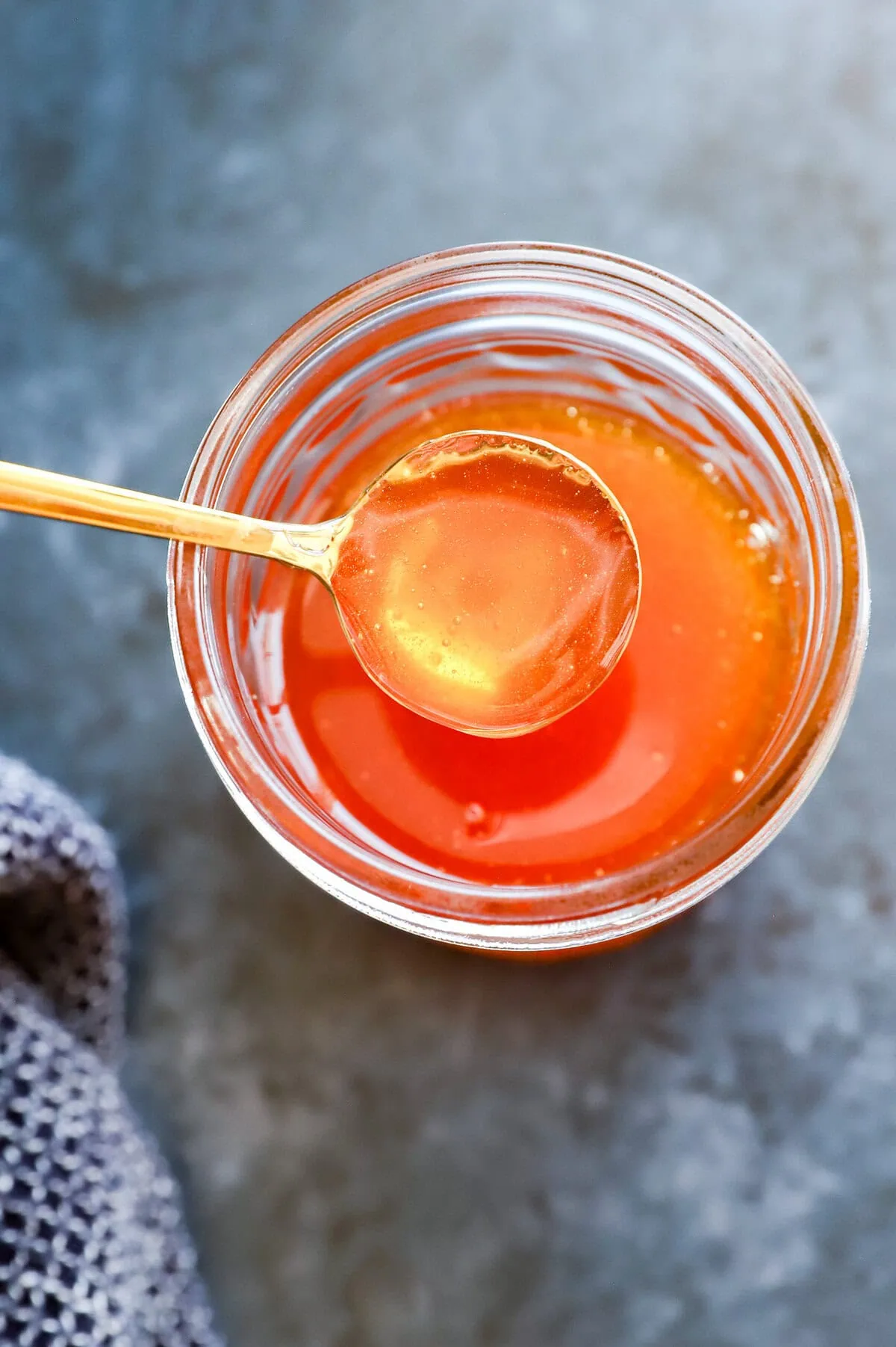 spoon of hot honey from jar