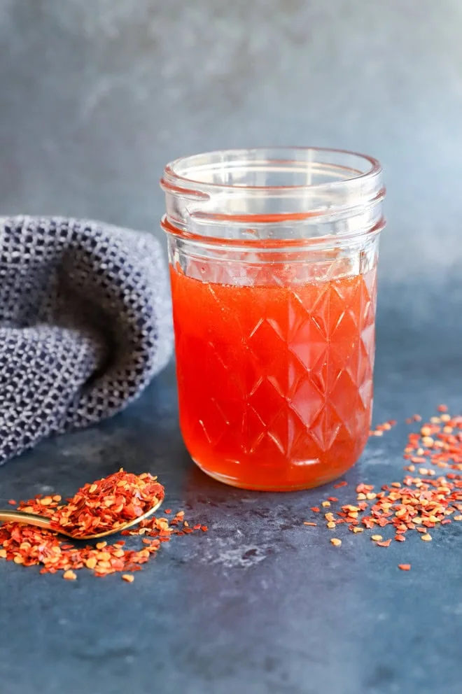 hot honey in a jar with red pepper flakes