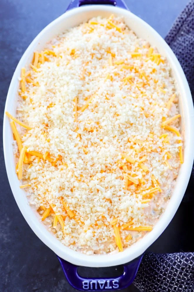 jalapeno popper dip in a pan before baking