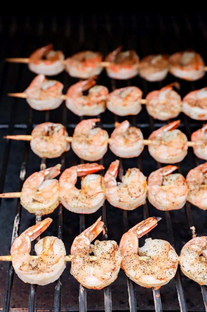Grilled shrimp skewers on the grill cooking
