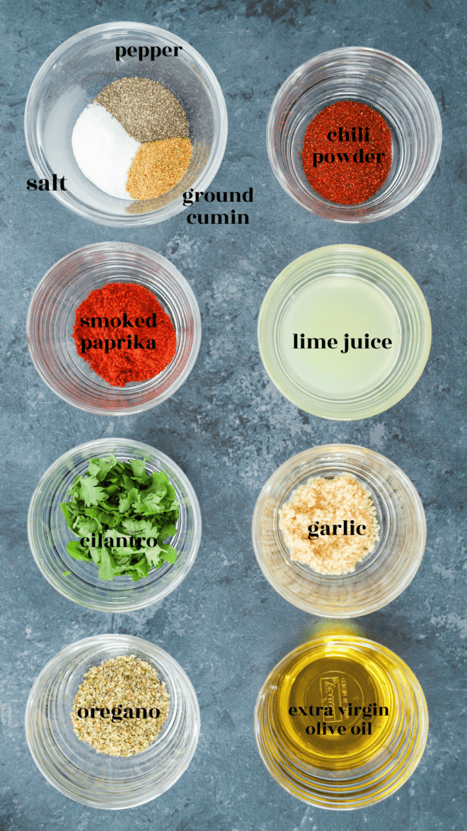 mexican chicken marinade ingredients in bowls with text labels