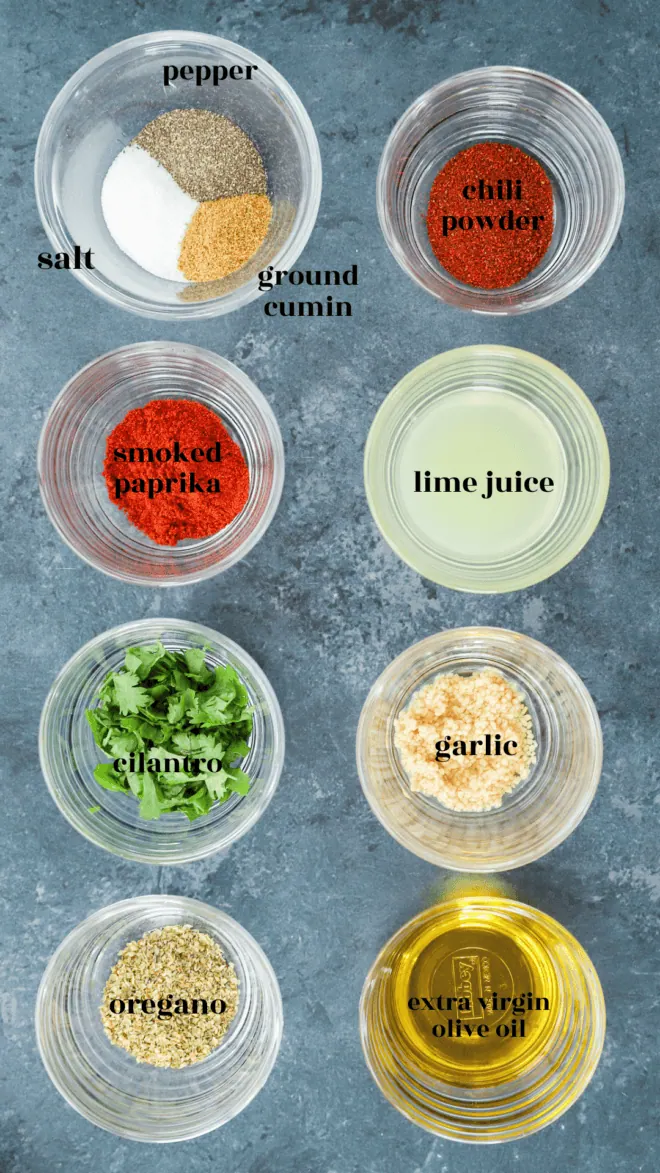 mexican chicken marinade ingredients in bowls with text labels