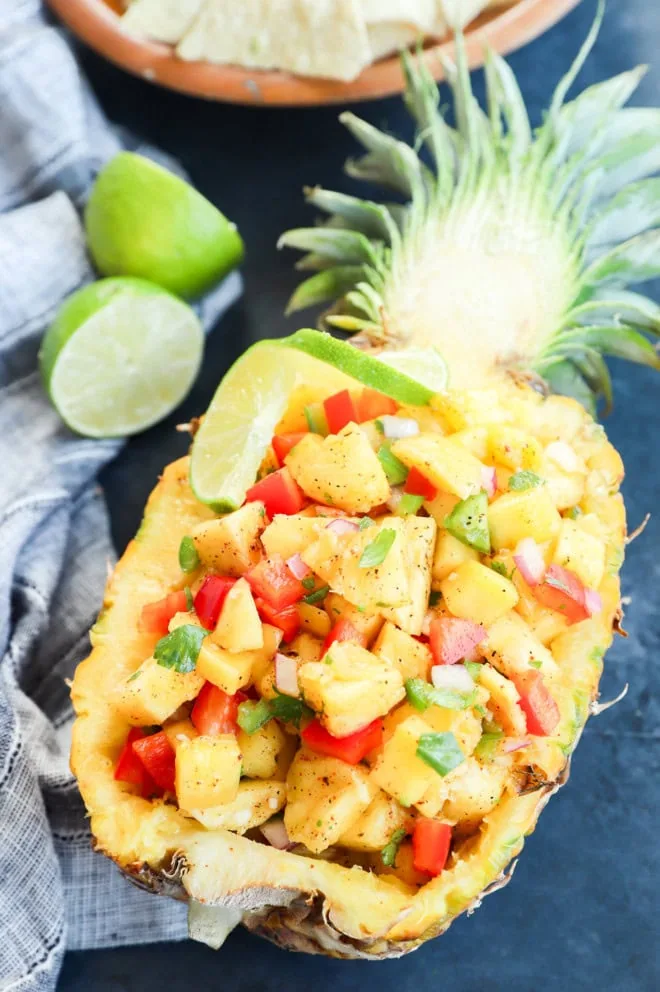 Pineapple filled with salsa and topped with fresh cilantro