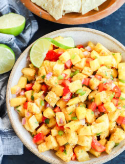pineapple mango salsa in a bowl with tortilla chips on the side
