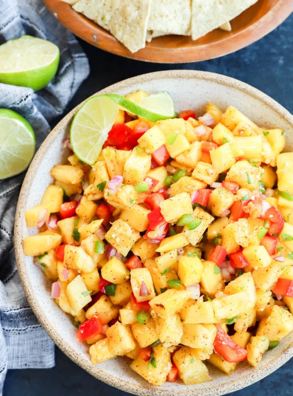 pineapple mango salsa in a bowl with tortilla chips on the side
