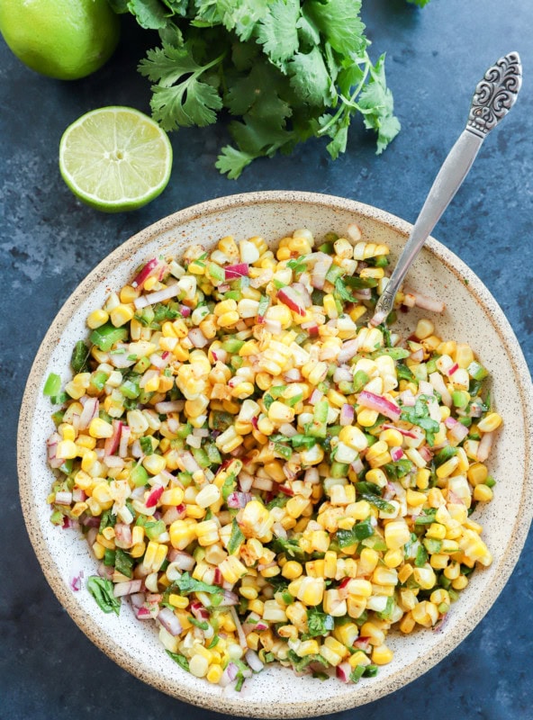 fresh vegetable appetizer in a bowl with cilantro and lime