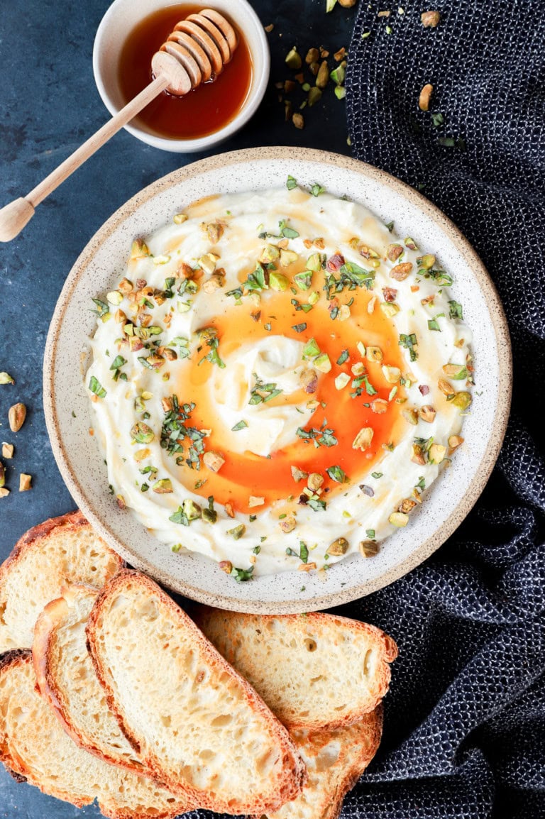 Cheesy dip with honey and toasted slices of bread