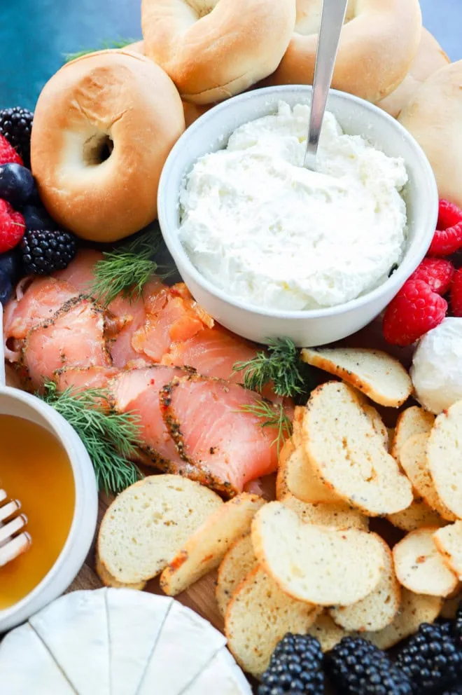 image of mini bagels whipped cream cheese and smoked salmon on a platter