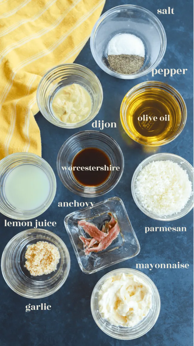 homemade caesar dressing recipe ingredients in bowls with text labels