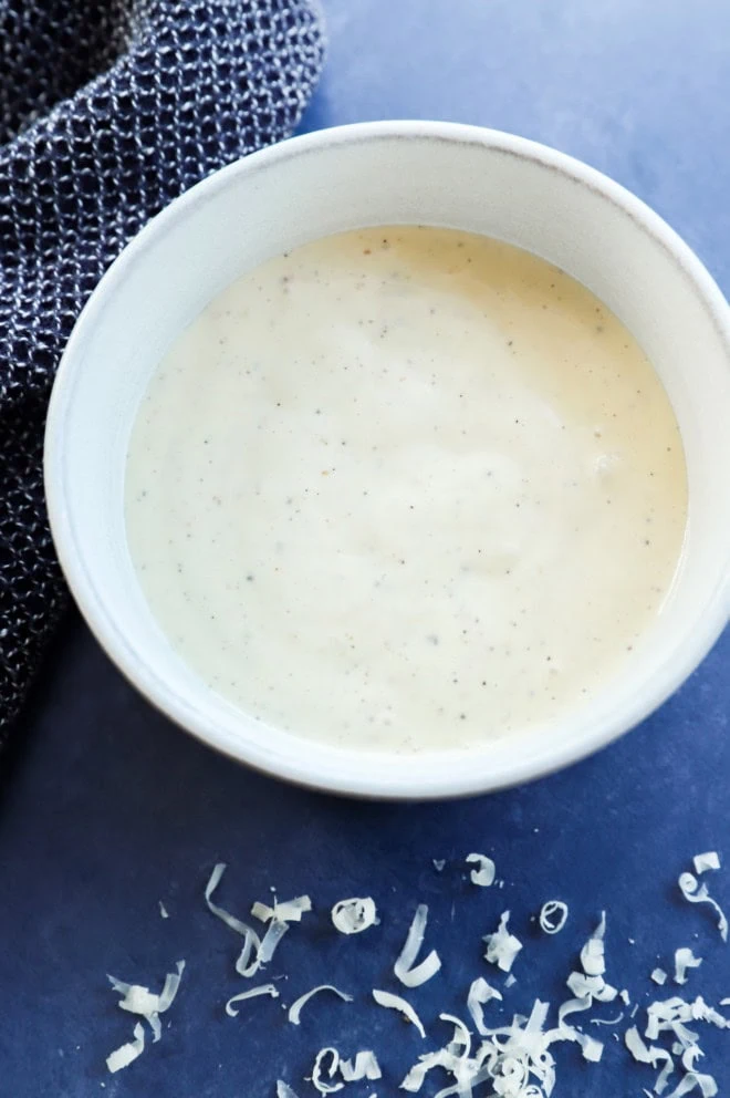 bowl of salad sauce that's creamy and smooth