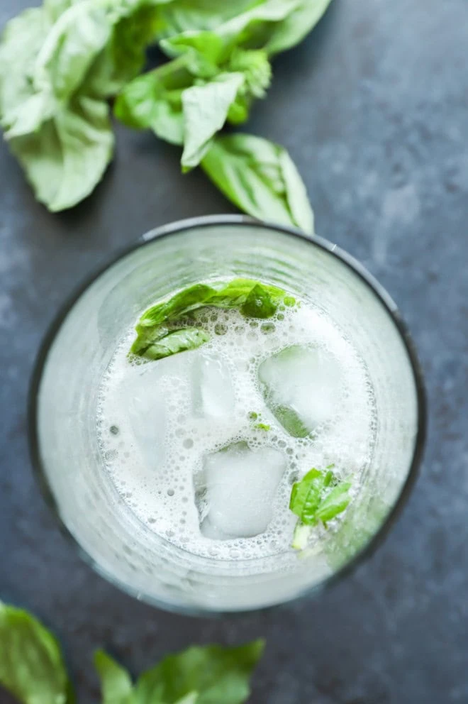 fresh gin basil smash in cocktail shaker muddled