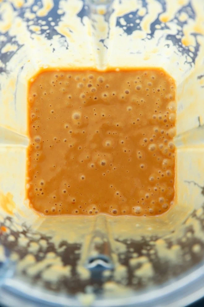 thai peanut dressing being made in a blender