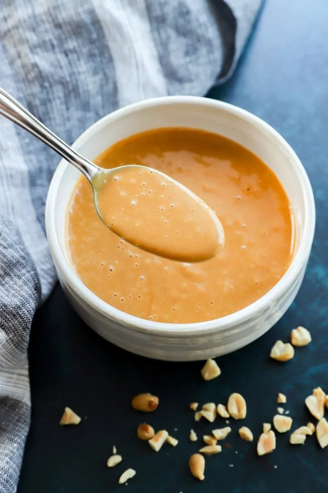 spoonful of asian-inspired sauce in a bowl