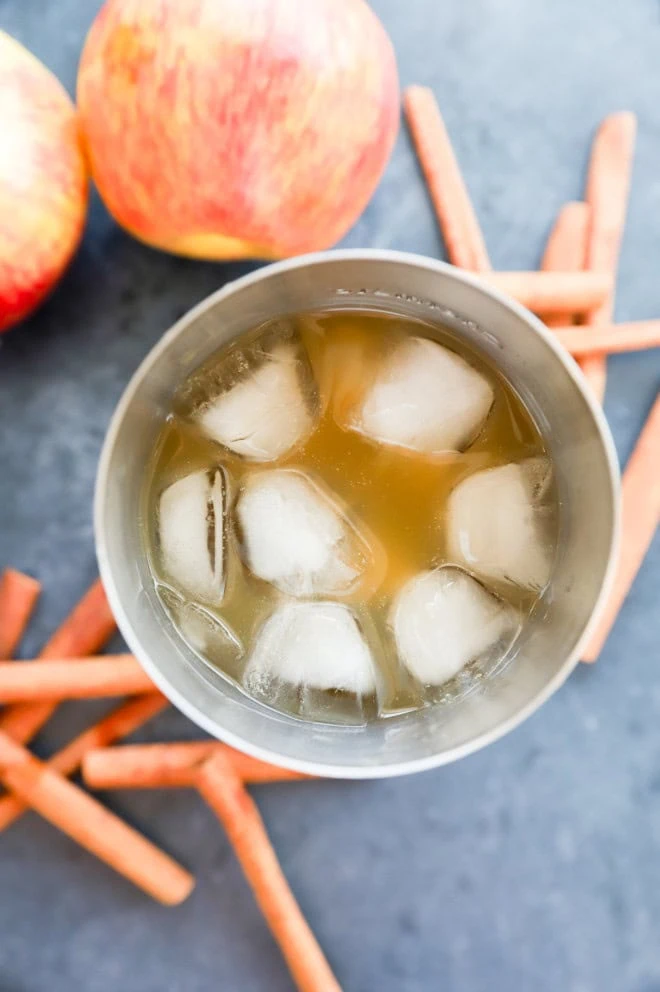 apple cider margarita in cocktail shaker with ice