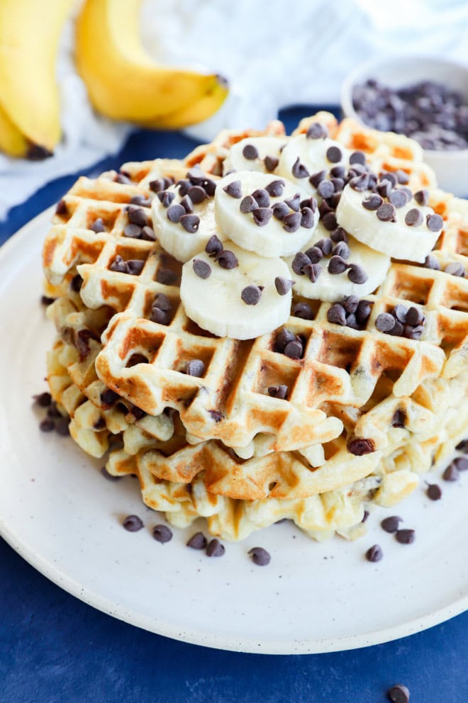 plate of brunch goodies with chocolate chips and fresh fruit sliced on top