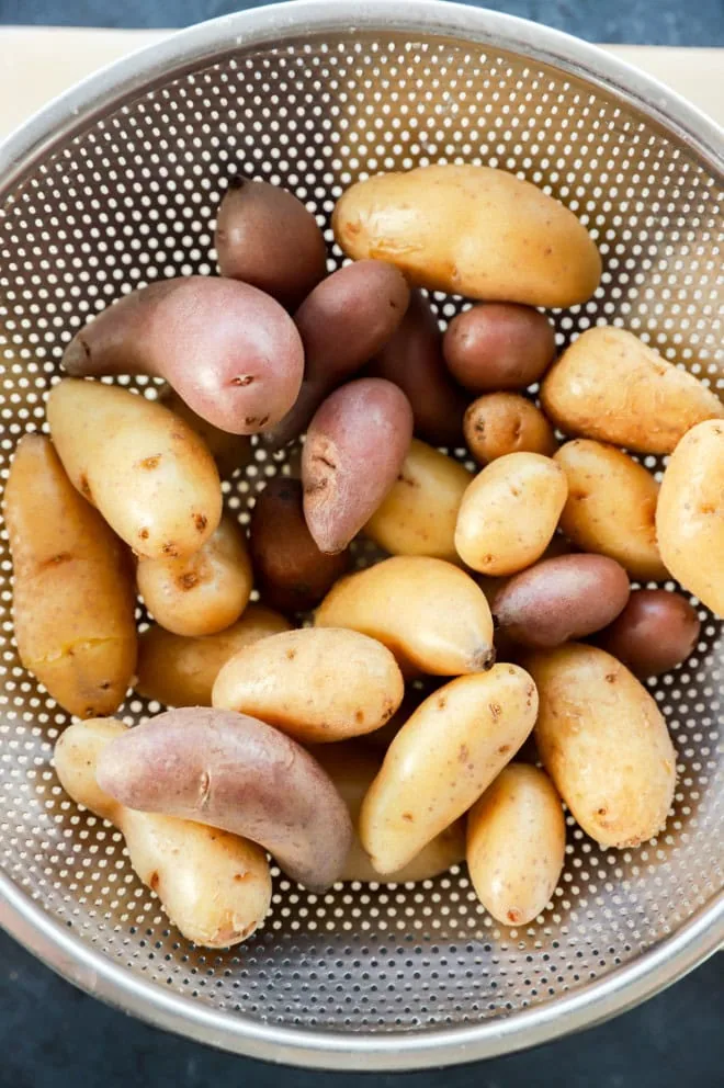 drained boiled fingerling potatoes in a colander