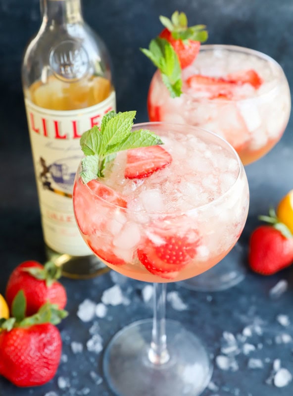 A bottle of french wine aperitif and cocktail in glasses