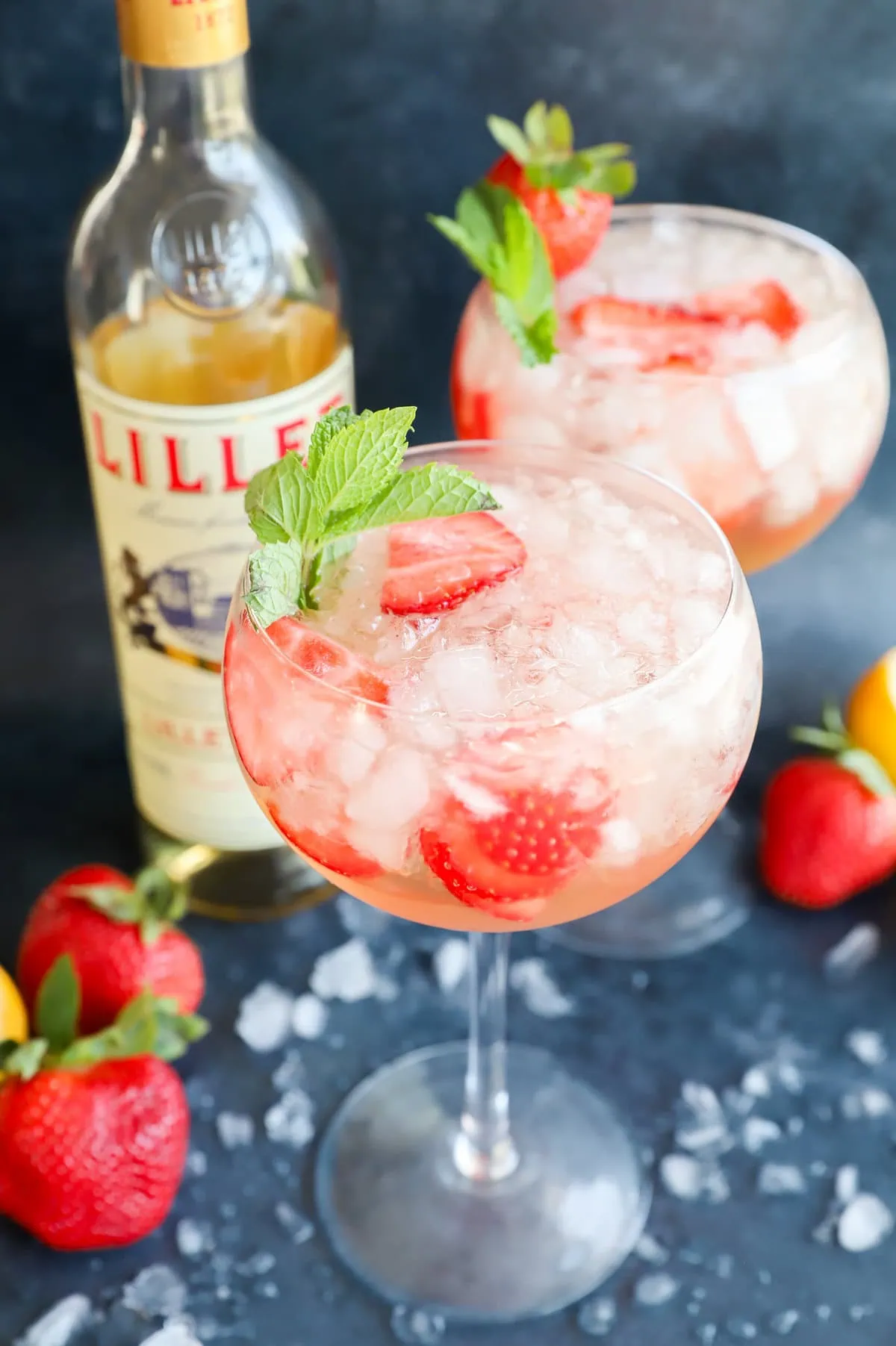 A bottle of french wine aperitif and cocktail in glasses