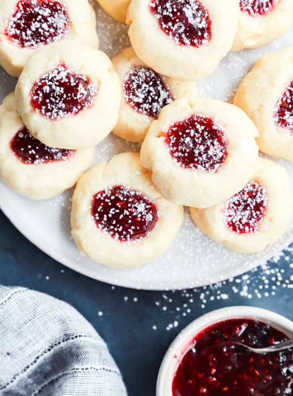 raspberry thumbprint cookies dusted with powdered sugar