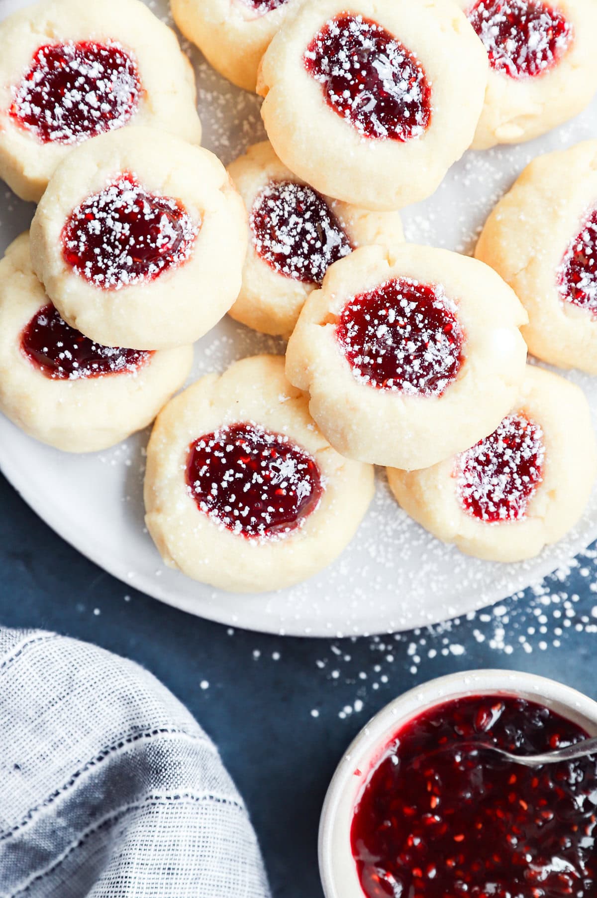 raspberry thumbprint cookies dusted with powdered sugar