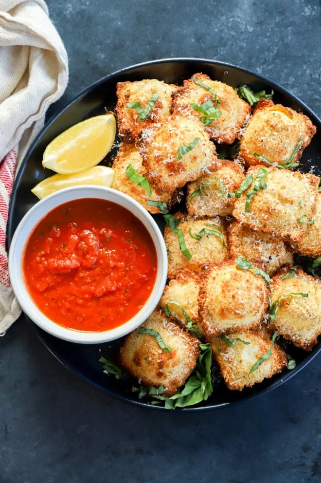 toasted cheese pasta on a plate with dipping sauce