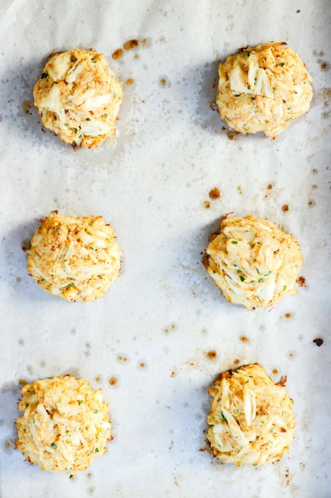 baked crab cakes on sheet pan after baking