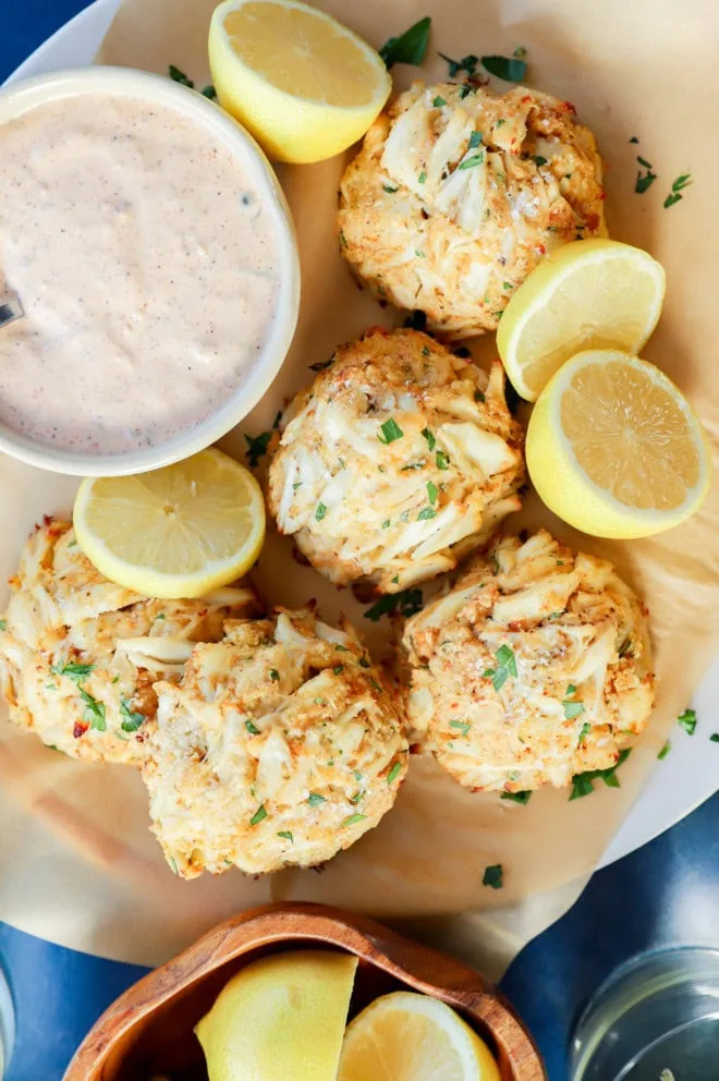 easy seafood appetizer with lemons on platter with sauce