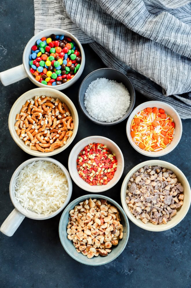 toppings in bowls for candy apple slices