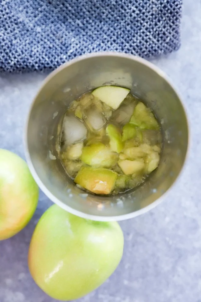 fresh apple martini in a cocktail shaker with ice