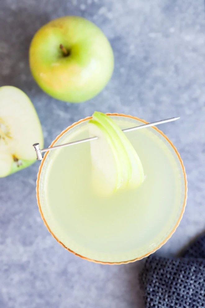 apples and fall cocktail in glass with garnish