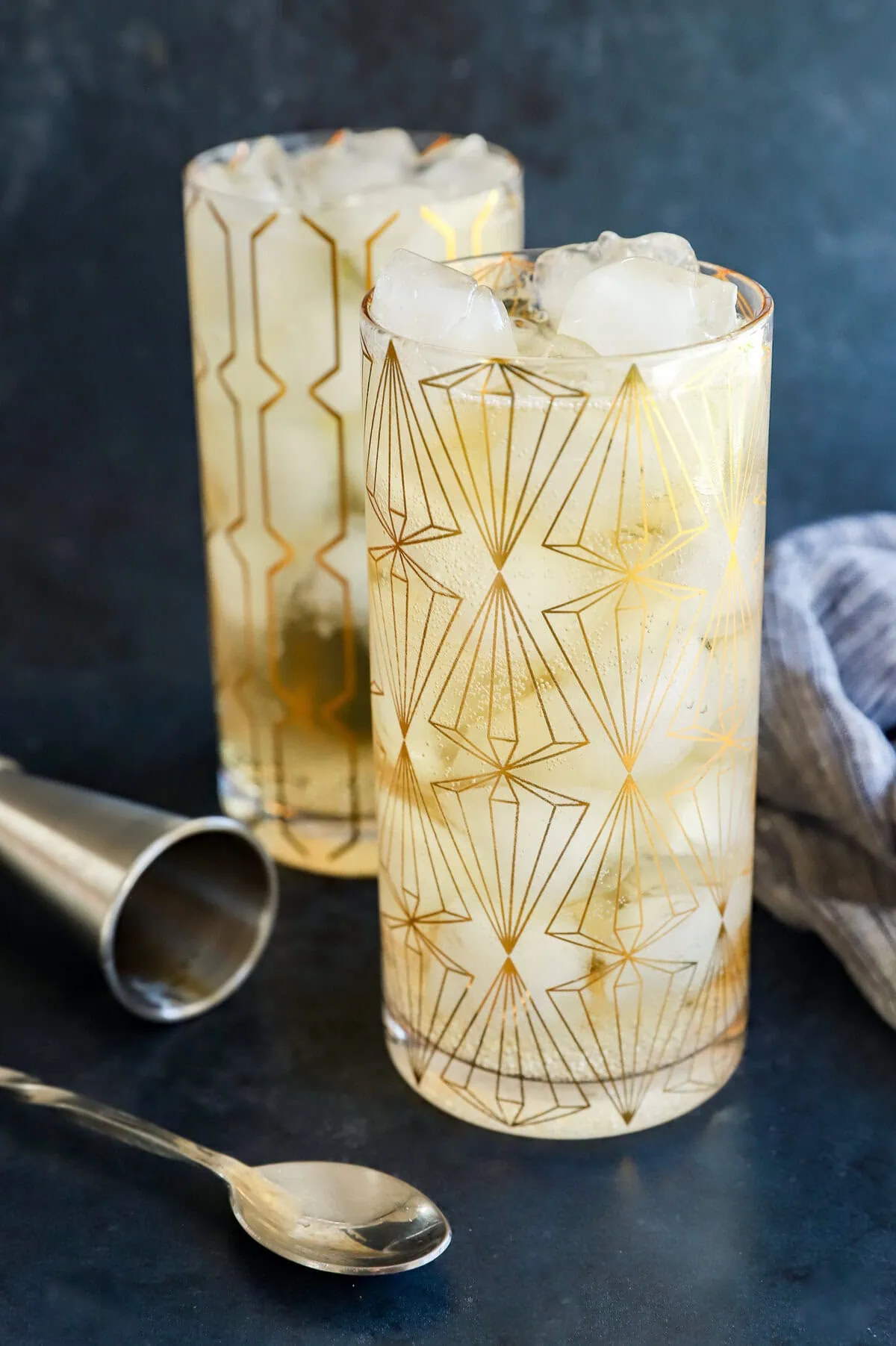 glasses of Japanese highball cocktail with cocktail spoon and jigger