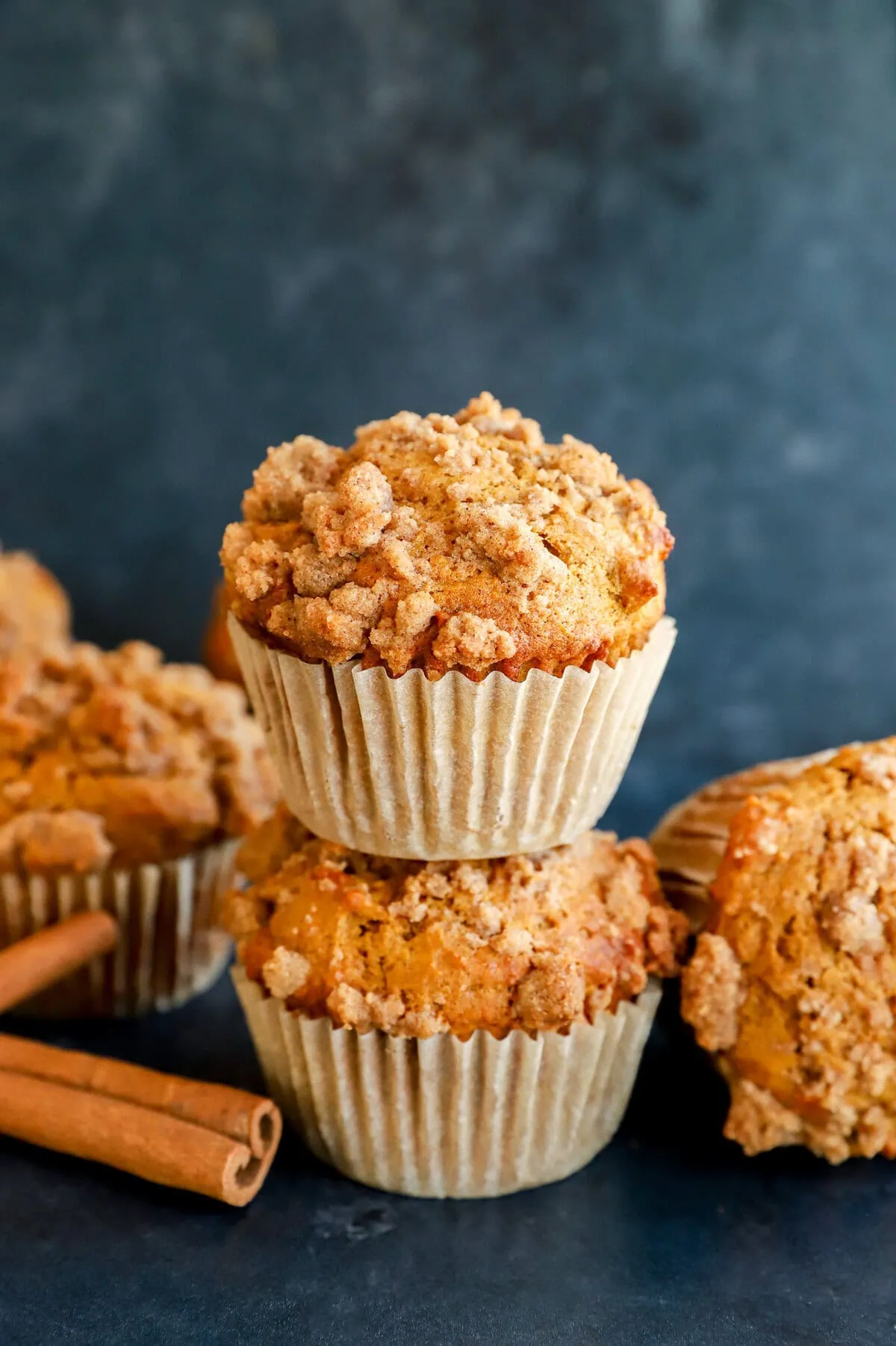 pumpkin banana muffins stacks with cinnamon sticks