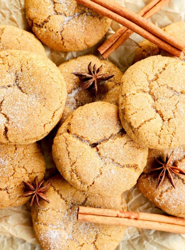 pumpkin pie spice cookies in a pile with cinnamon sticks and star anise