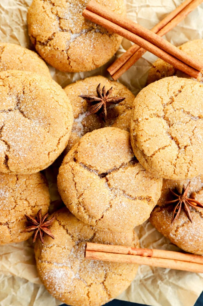 pumpkin pie spice cookies in a pile with cinnamon sticks and star anise