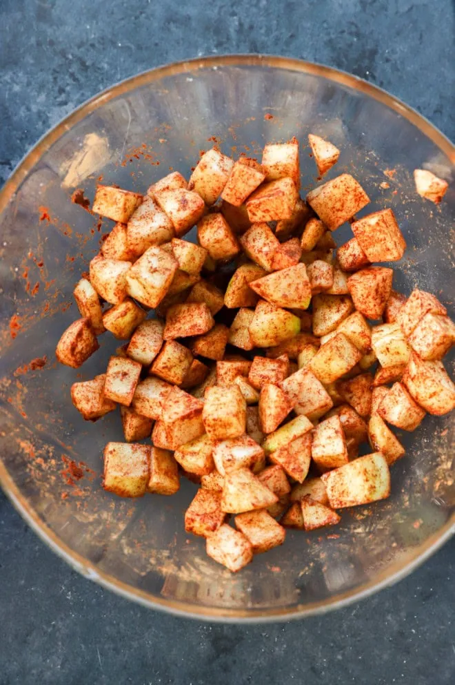 spiced cinnamon apples in glass bowl on counter