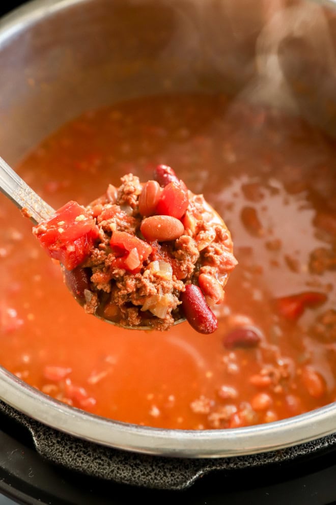 ladle out instant pot chili from the instant pot insert