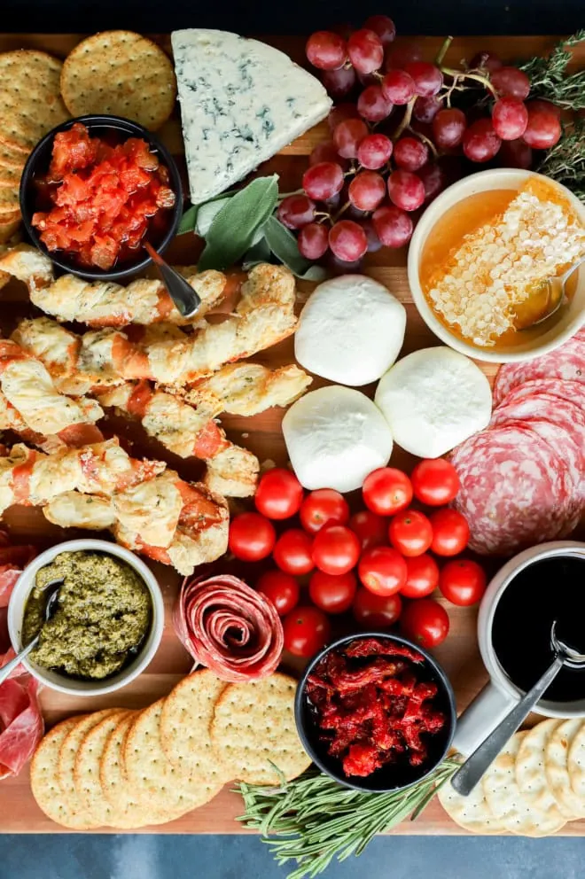 italian charcuterie board image with fresh herbs