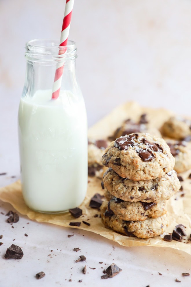 stack of chewy baked treats for the holidays with carafe of milk with straw